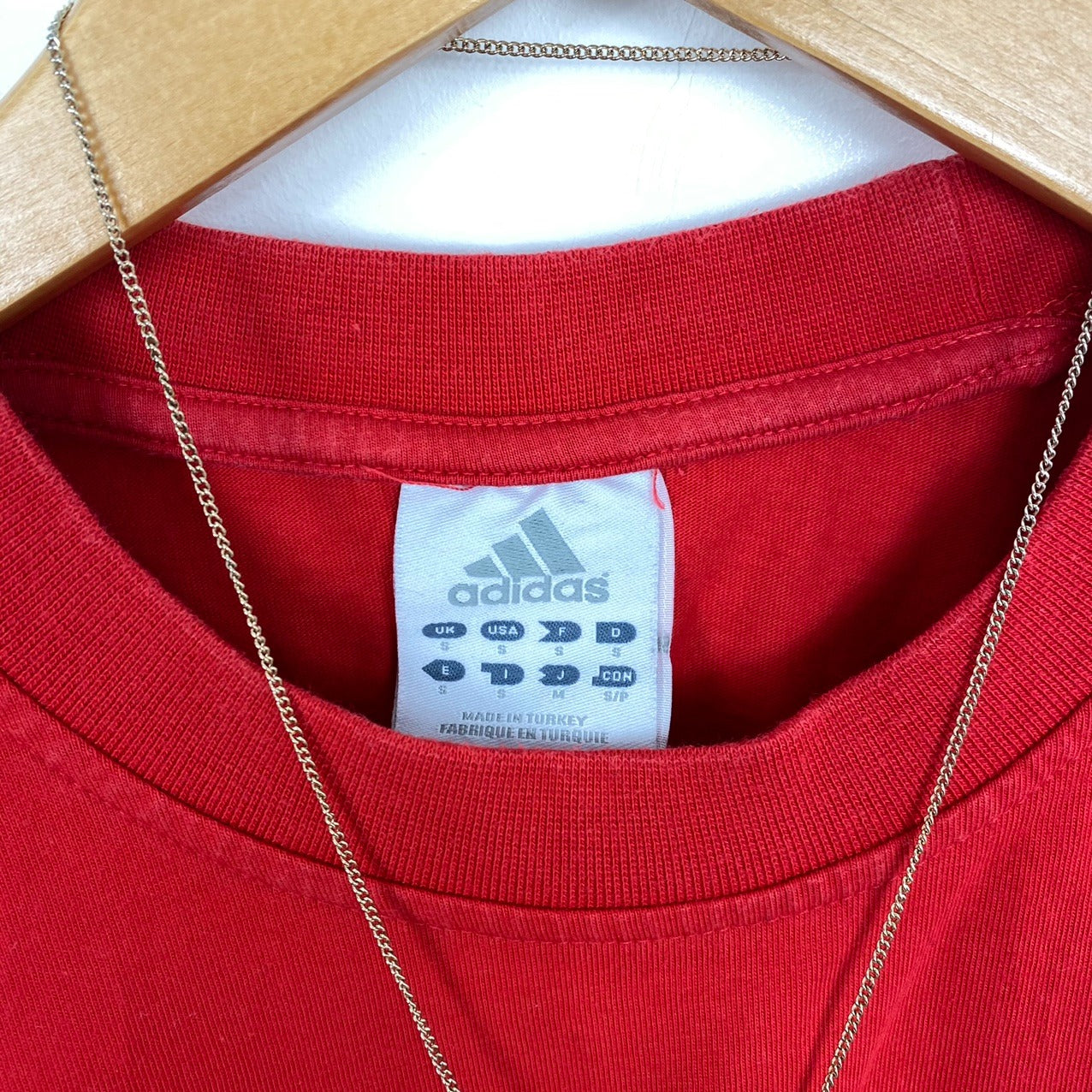 Adidas red spell out tshirt small